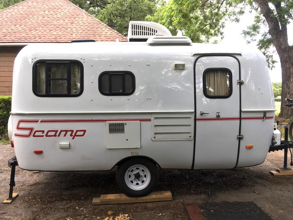 This immaculate 16' standard side dinette Scamp trailer is loadedwith ...